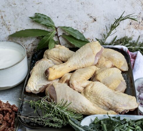 Selection of raw Grassland Sommerlad Heritage chicken portions including wings, marylands, drumsticks, breasts, and offal